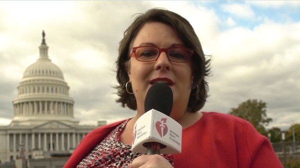 Advocacy Highlight Reel video screenshot of woman speaking into AHA microphone in front of the Capitol Building