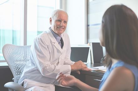 doctor consulting with female patient