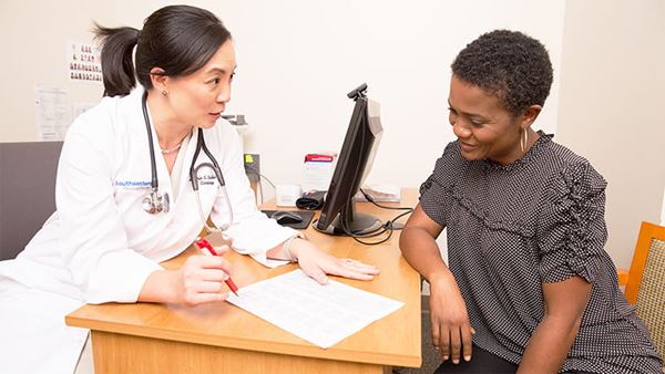 Doctor reviewing labs with patient