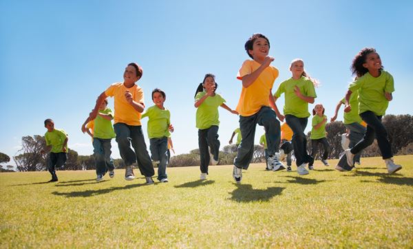 group of kids running at school recess