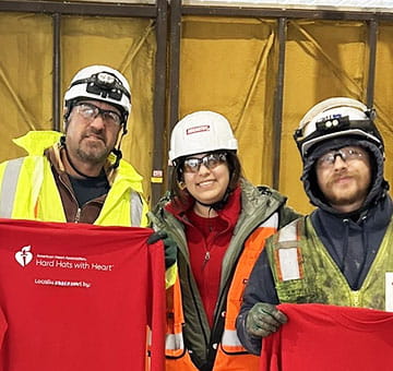 image of three construction workers smiling for camera