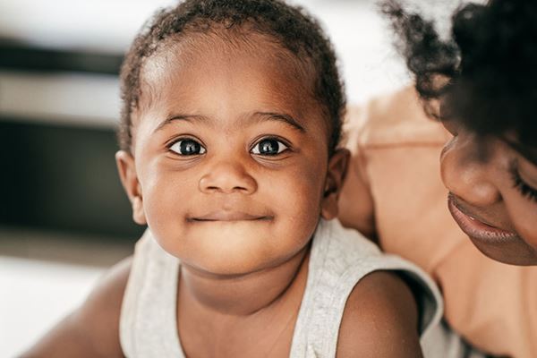 infant and mother closeup