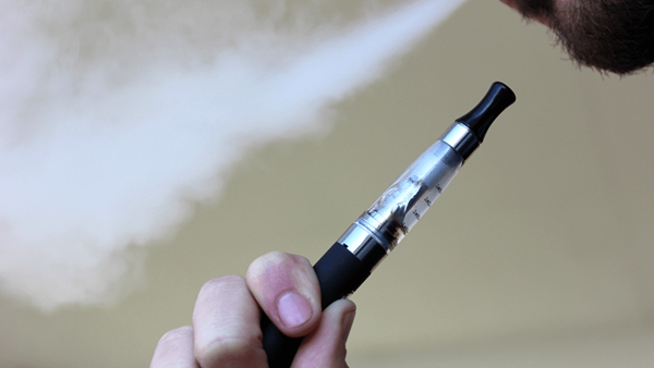 Person smoking an e-cigarette